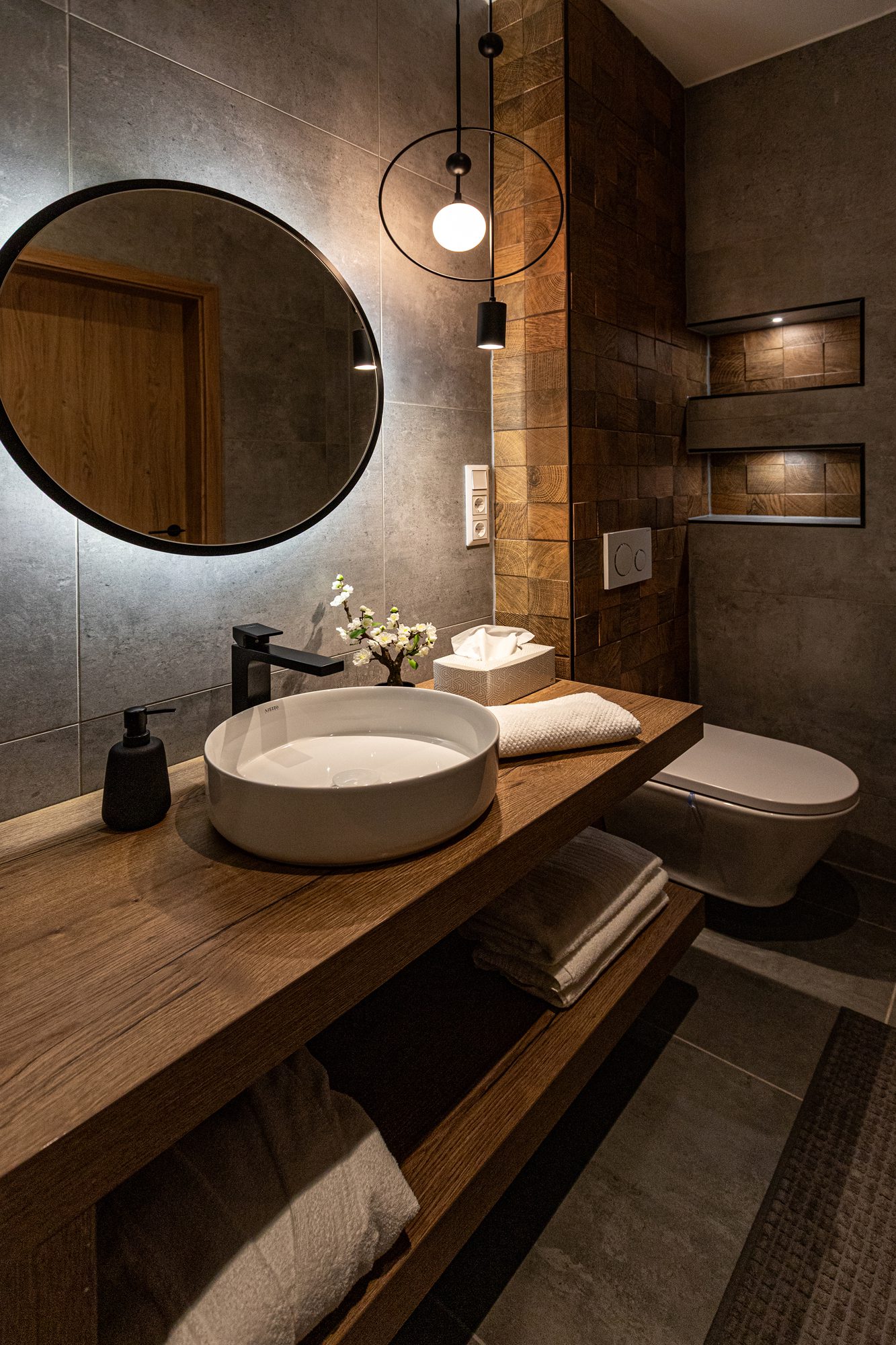 Bathroom villa accommodation Hungary - Villa Porta Verde I bathroom with round mirror and wooden vanity